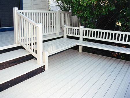 vinyl rail with built-in bench on brock deck